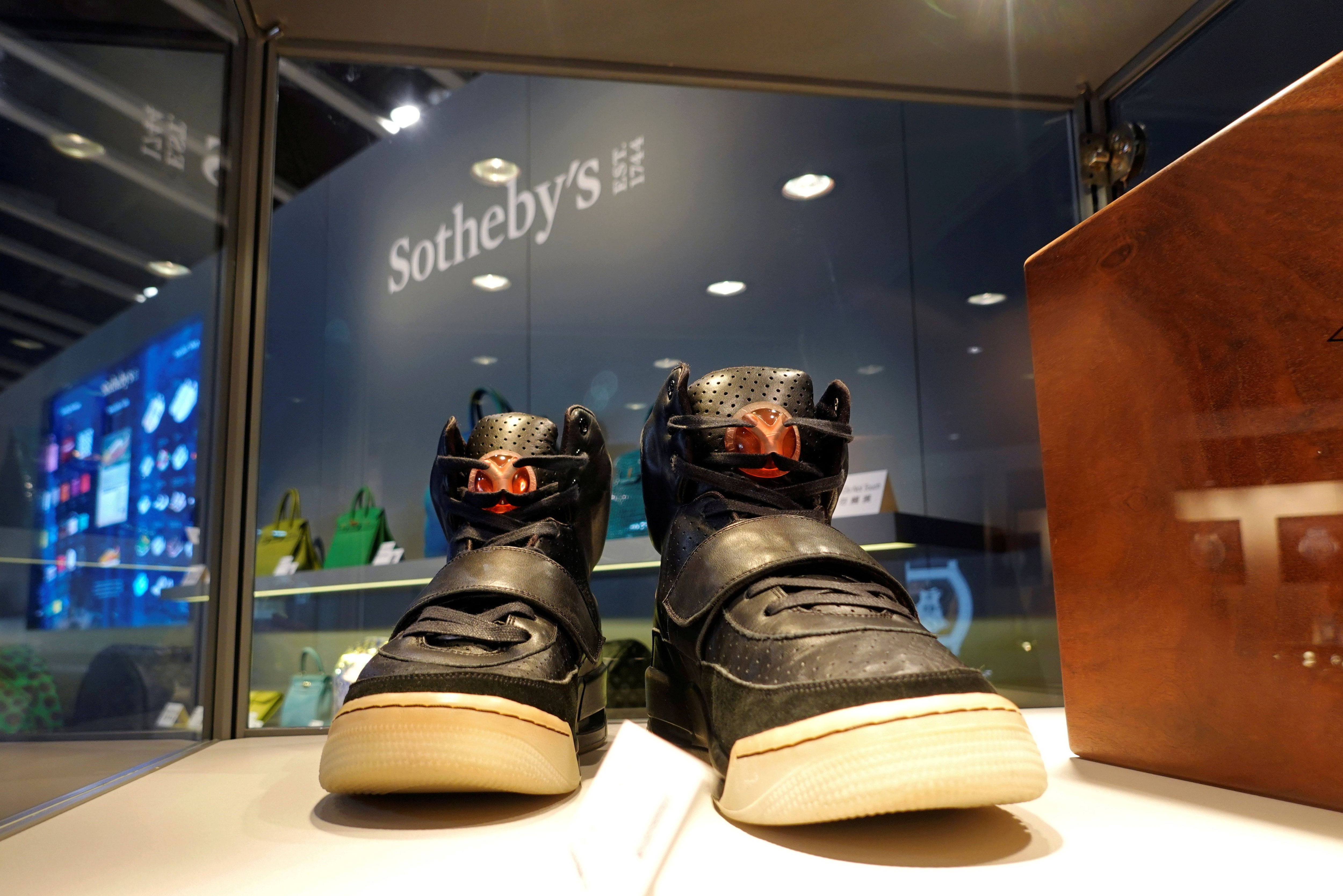 FILE PHOTO: A pair of 'Nike Air Yeezy 1' prototype sneakers designed by Kanye West, are displayed at the Hong Kong Convention and Exhibition Centre before going up for private sale at Sotheby's, in Hong Kong, China April 16, 2021. REUTERS/Joyce Zhou/File Photo